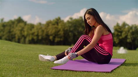 Asian Woman Tying Laces On Her Sneakers Cute Girl Stretching On Yoga