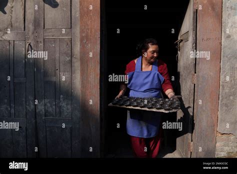 A Potter Carries Earthen Lamps Being Prepared For The Upcoming Tihar