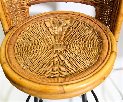 This bar stool's seat is woven of natural rattan and the frame is handmade of wood. Pair of Vintage Swivel Woven Rattan Bar Stool, 1960s For ...