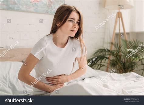 Upset Girl Touching Stomach While Suffering Stock Photo 1573258414