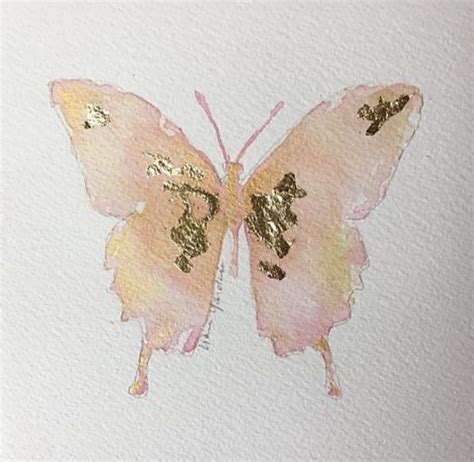 A Watercolor Painting Of A Pink Butterfly With Gold Numbers On Its Wings