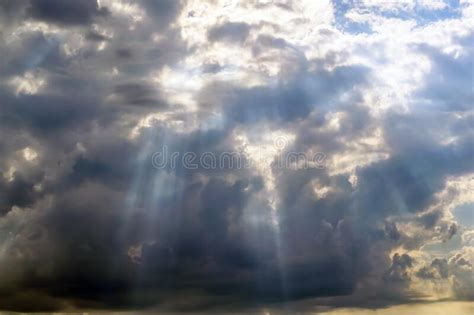 The Sun S Rays Passing Through Thunderclouds Bottom View Stock Photo