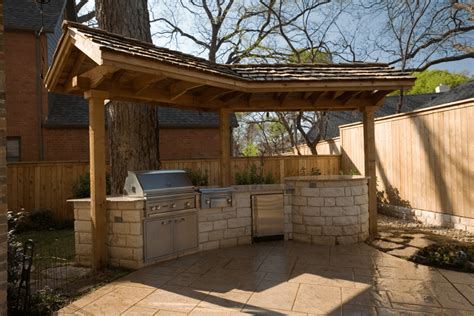Oxidized woven steel is used to create a textured backdrop to this outdoor kitchen. Outdoor Kitchen Gallery - Lawn Connections, LLC