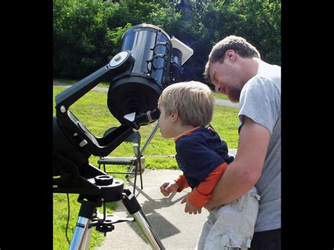 Child Viewing Through A Telescope At Golden Pond Planetarium And