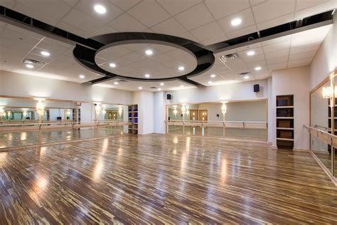 Yoga Studio With Calming Lighting And Stained Hardwood Floors Efc