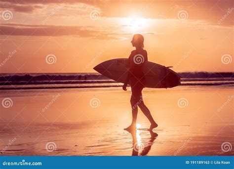 Portrait Of Surfer Girl With Beautiful Body On The Beach With Surfboard