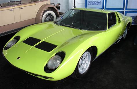 Lamborghini Miura In Green Waiting Its Turn At Auction 1600x1036 Os