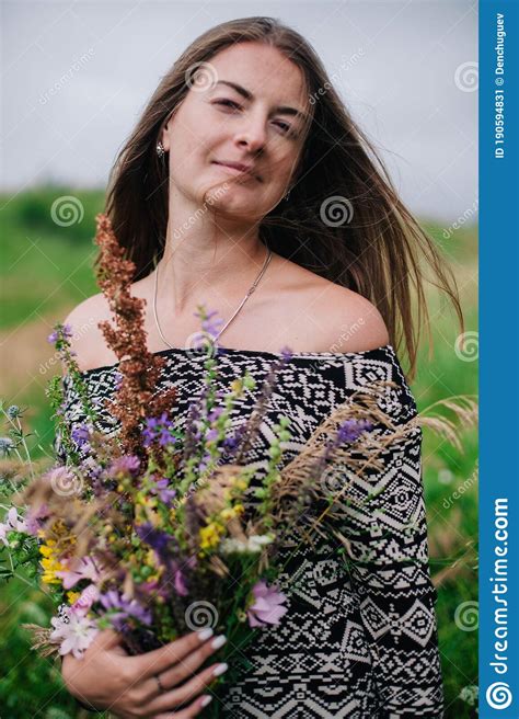 beautiful slender girl in a meadow dress with wildflowers stock image image of chic field