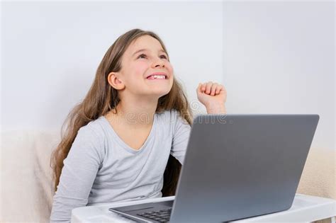 Portrait Of Attractive Cute Happy Smiling Girl 6 7 Old Sitting Using Laptop Indoor White