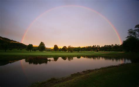 Panoramic Photography Of River Near Trees Under Rainbow River