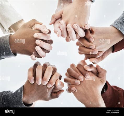 Below Close Up View Of People Holding Hands In Circle Shape A Group Of