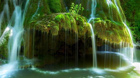 Waterfall In Romania River Rock With Green Moss Flowing