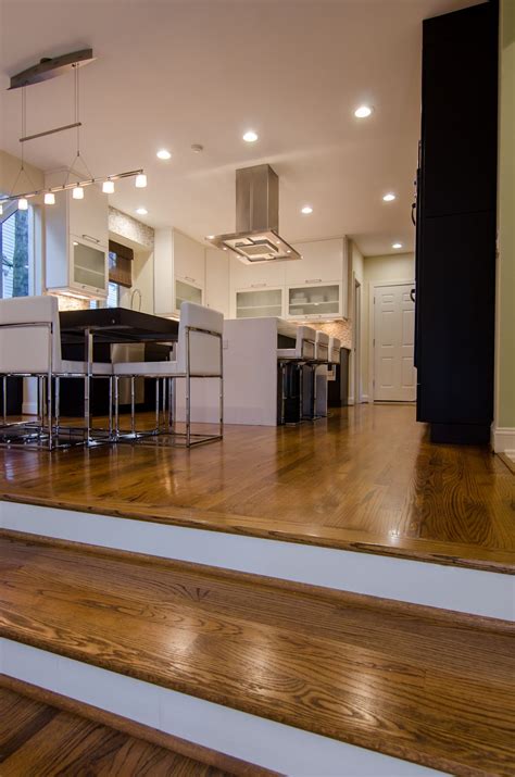 Wide selection on daltile vinyl flooring. Hardwood step transition between family room and kitchen ...