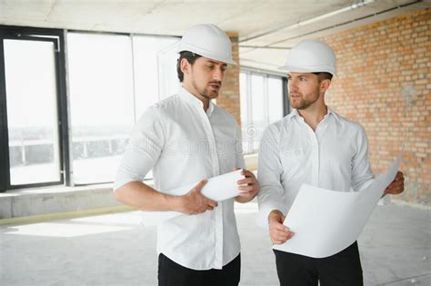 Two Young Man Architect On A Building Construction Site Stock Photo