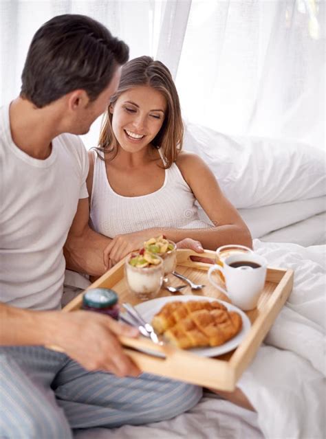 Nothing Better Than Breakfast In Bed A Loving Young Couple Enjoying