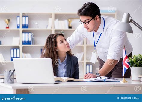 The Teacher Explaining To Student At Language Training Stock Photo