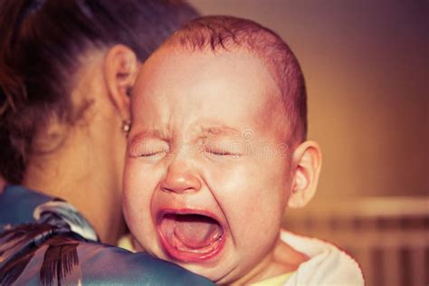 Mom Soothes Baby The Baby Is Crying Stock Photo Image Of Care