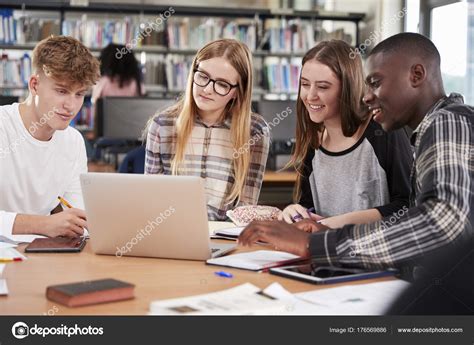 Group Of College Students Collaborating Stock Photo By ©monkeybusiness