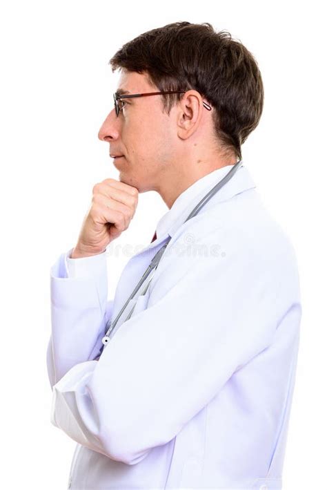 Profile View Of Man Doctor Thinking With Hand On Chin Stock Photo