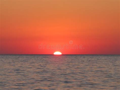 Panorama Of A Red Sunset On The Sea The Sun Disappears Behind The