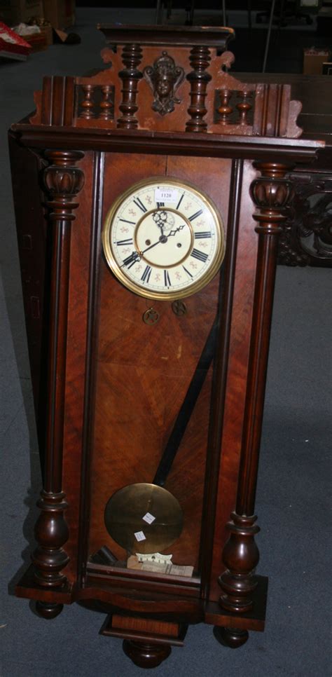 A Late 19th Century Walnut Vienna Style Wall Clock With Eight Day