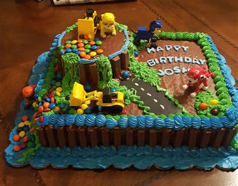 Paw patrol icing decorations in red, dark blue and bright blue. Paw Patrol chocolate explosion cake | Chocolate explosion ...