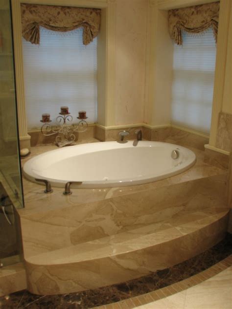 There is a fully equipped shared bathroom with shower and a hairdryer. picture of jacuzzi bath tubs in meditterenean house ...