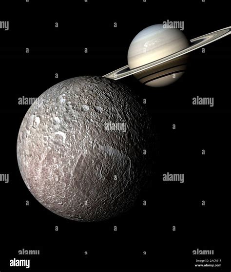 Saturn And Mimas From Space Computer Artwork Showing The Planet Saturn