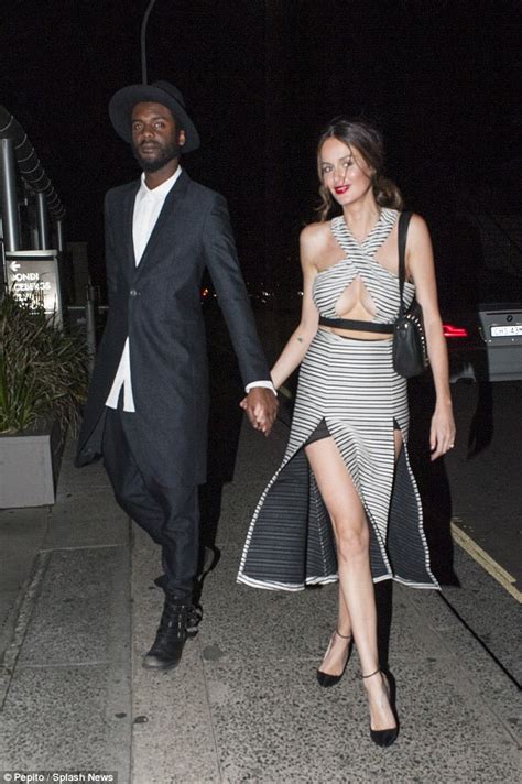nicole trunfio busts out again in keyhole top which shows off plenty of underboob as she attends