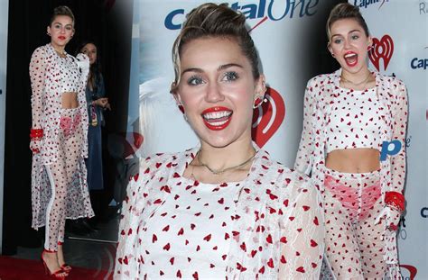 wardrobe malfunction miley cyrus flashes red underwear in sheer outfit