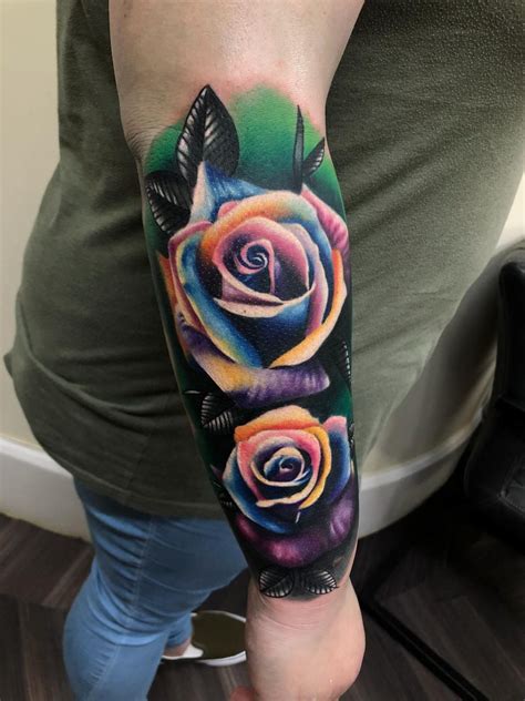 A little rose tattoo on wrist is cover up with a heart and rose. Beautiful rainbow coloured rose tattoo cover up by Lorand ...