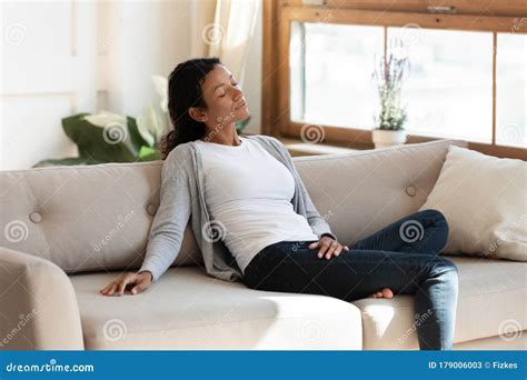 Black Millennial Woman Sit On Sofa In Living Room Stock Image Image