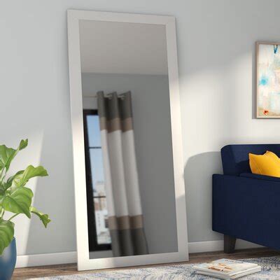 Made from solid wood, its frame features two turned legs atop curved feet for a classic look with a versatile solid finish that works with your current colour scheme. 7 Foot Mirror | Wayfair