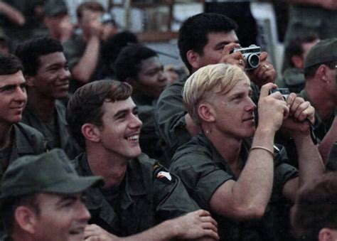 Members Of The 101st Airborne Division Take Photographs During The Bob