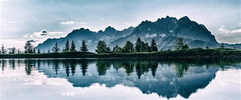 Mountains Pine Trees Lake Nature Clouds Sun Rays Grass Water Reflection