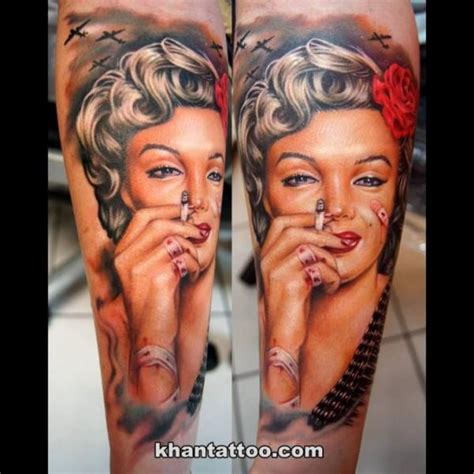 colored beautiful looking forearm tattoo of smoking merlin monroe with planes tattooimages