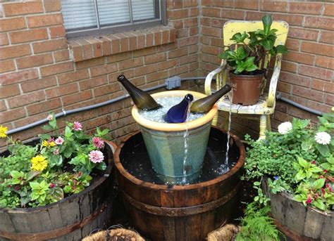 Outdoor drinking fountains for parks make back yard or even front yard nice. Wine Bottle Fountain - DIY Fountain Ideas - 10 Creative ...