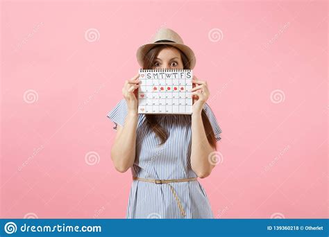 Portrait Of Young Woman In Blue Dress Hat Holding Periods Calendar For