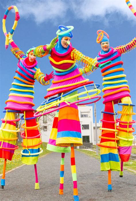 Multi Coloured Stilt Walkers Book Stilt Walkers For Events Hire Walkabout Acts