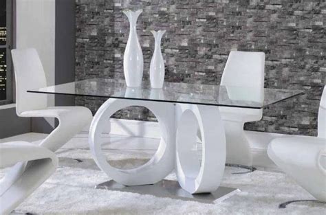 White Dining Table With Unique Glossy Base The Crystal Clear Glass Allows For An Undisturbed
