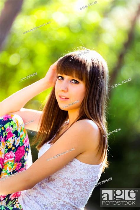 Cute Teen Girl In In Park Looking At Camera Stock Photo Picture And
