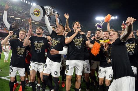 Valencia Players Celebrate With Their Trophy Fater