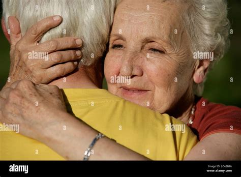 Old Woman Hugs Her Husband Stock Photo Alamy