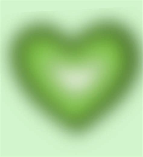 A Green Heart Shaped Object Is Shown In The Middle Of An Image With A