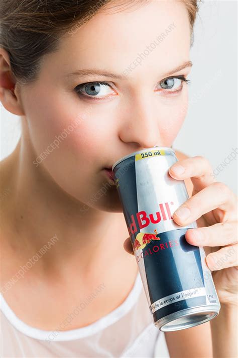 Woman Drinking Red Bull Stock Image C0343817 Science Photo Library