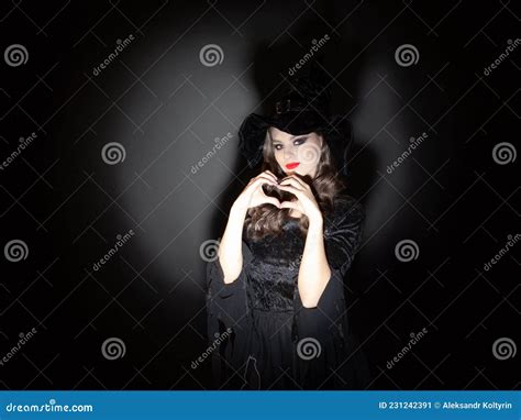 Witch At Halloween Party A Young Beautiful Brunette Woman In A Classic