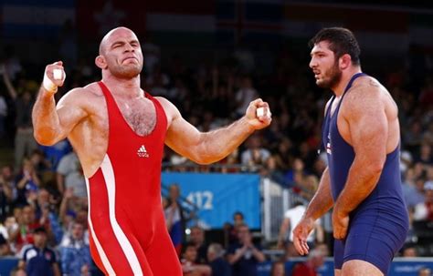 Uzbekistans Artur Taymazov In Red Celebrates Victory фото