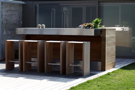 Outdoor bbq kitchens provide amazing space for all family members to gather in backyard patio. 7 Tips for Lighting Outdoor Kitchens | Lighting & Decor Mag