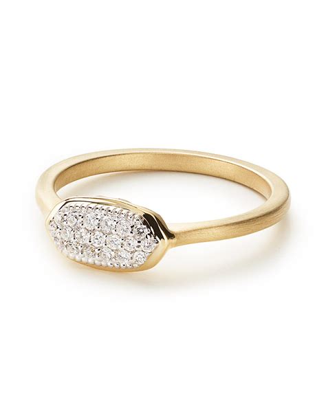 Halo engagement ring settings can give the appearance of a larger center stone. Isa Pave Diamond Ring | Kendra Scott