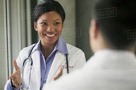 Female Doctor Speaking With Patient Stock Photo Dissolve